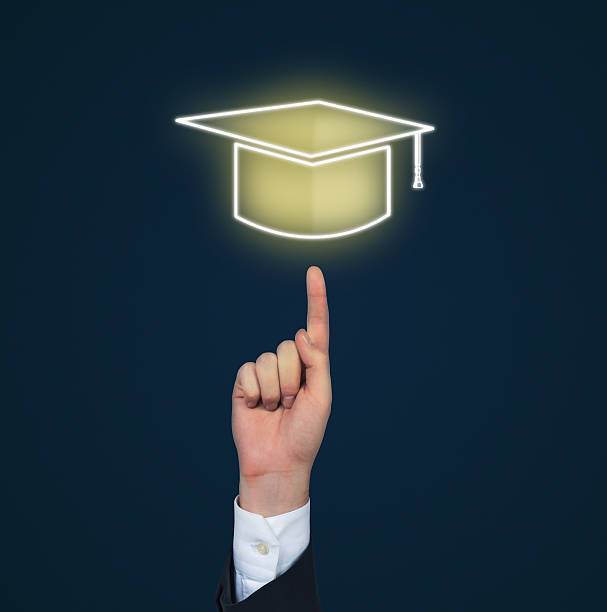 hand pointing to bachelor cap on a blue background